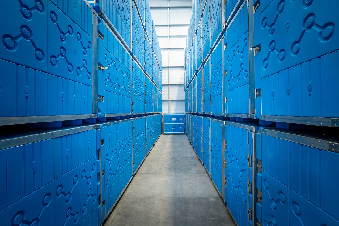 Passive temperature controlled containers stacked in warehouse